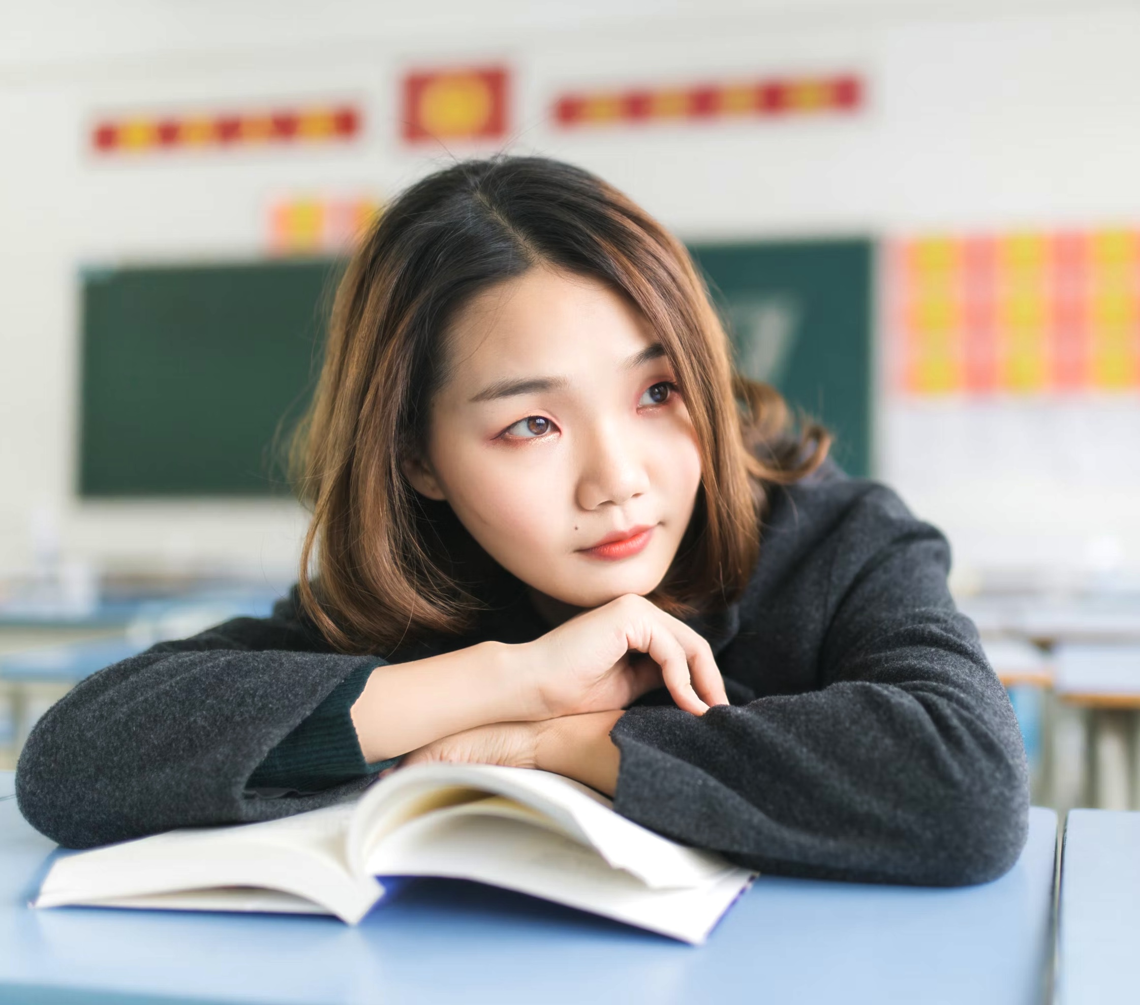 Student smiling in a classroom