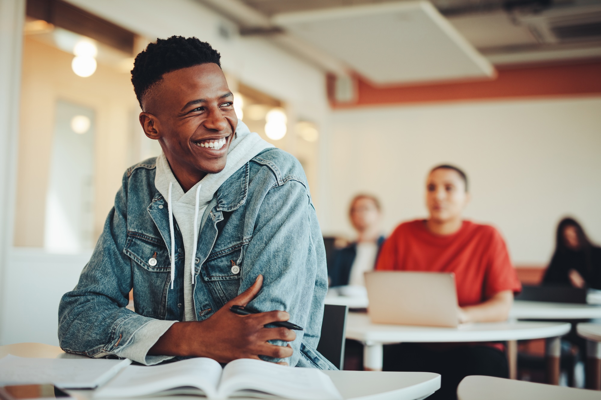 Student smiling in a classroom